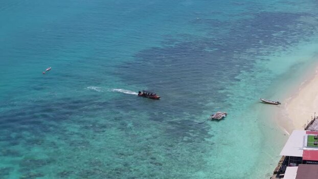 Aerial view of Perhentian Islands with boat in turquoise water Malaysia. Aerial view of Perhentian Islands with boat in turquoise water Malaysia.