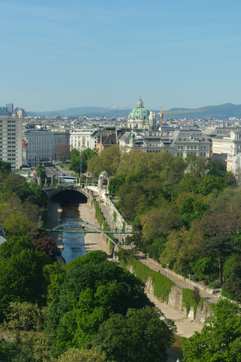 Aerial view of St. Charles s Church dome rising above the lush greenery of Stadtpark and the Wien River canal in Vienna Vienna Austria. Aerial view of St. Charles s Church dome rising above the lush greenery of Stadtpark and the Wien River canal in Vienna Vienna Austria.
