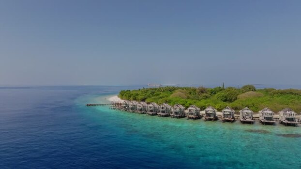 Aerial view of bungalows on island Maldives. Aerial view of bungalows on island Maldives.