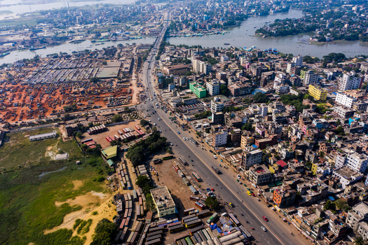 Aerial view of Gabtoli Bus Terminal Internal Road with surrounding urban infrastructure dense buildings and busy traffic in Dhaka Dhaka Division Bangladesh.