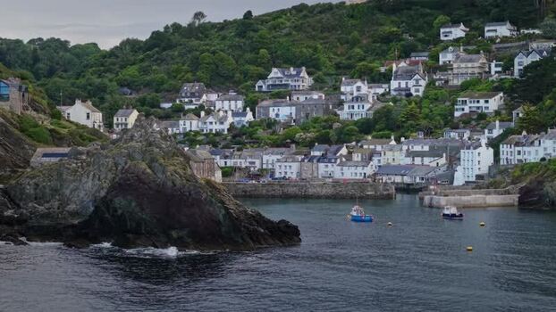 Aerial view of Polperro harbor and coastal village United Kingdom. Aerial view of Polperro harbor and coastal village United Kingdom.