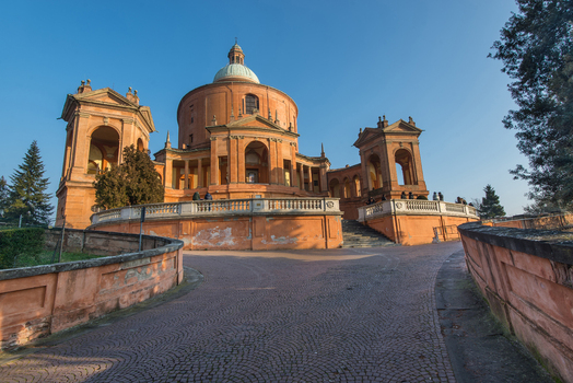 View of the Santuario Madonna di San Luca with its iconic dome and circular portico under a clear blue sky in Bologna Emilia Romagna Italy. View of the Santuario Madonna di San Luca with its iconic dome and circular portico under a clear blue sky in Bologna Emilia Romagna Italy.