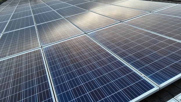 Aerial view of solar panels installed on a residential rooftop in Akron Pennsylvania United States.