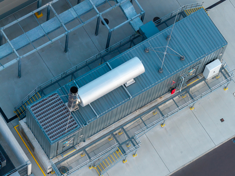 Aerial view of an advanced data center facility with industrial cooling units metal structures and concrete flooring in Warsaw Masovian Voivodeship Poland. Aerial view of an advanced data center facility with industrial cooling units metal structures and concrete flooring in Warsaw Masovian Voivodeship Poland.