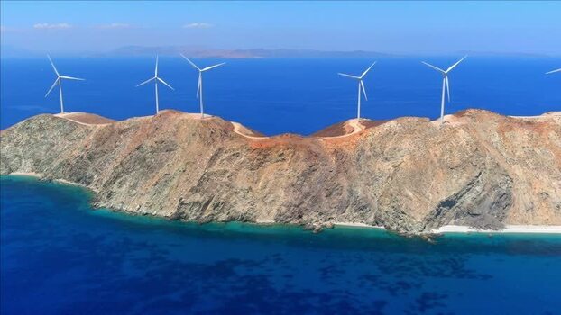 Aerial view of wind farm on rocky island coastline Greece. Aerial view of wind farm on rocky island coastline Greece.