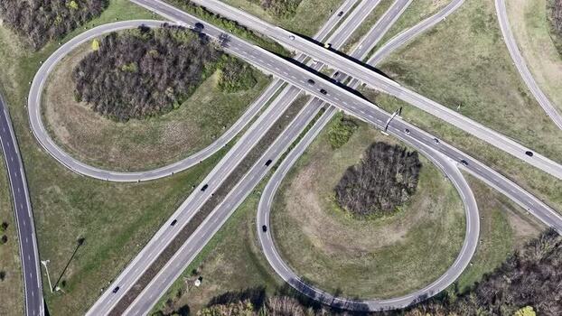 Aerial view of highway cloverleaf interchange France.