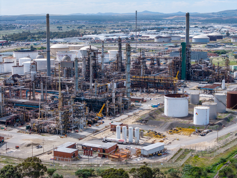 Aerial view of the Milnerton oil refinery with industrial infrastructure storage tanks and processing towers in Cape Town Western Cape South Africa. Aerial view of the Milnerton oil refinery with industrial infrastructure storage tanks and processing towers in Cape Town Western Cape South Africa.