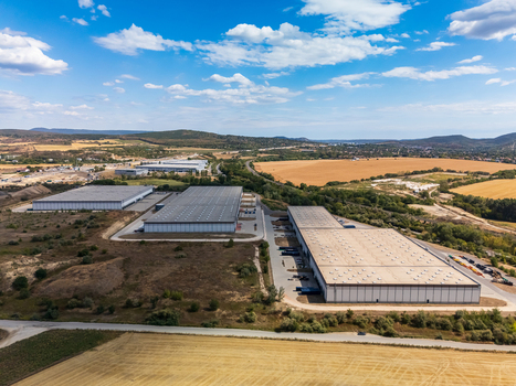 Aerial view of warehouses in Paty Hungary beside fields and access roads Aerial view of warehouses in Paty Hungary beside fields and access roads