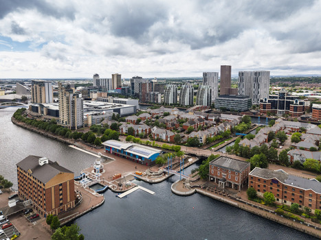 Aerial view of MediaCityUK and the surrounding modern urban development along the waterfront in Salford England United Kingdom. Aerial view of MediaCityUK and the surrounding modern urban development along the waterfront in Salford England United Kingdom.