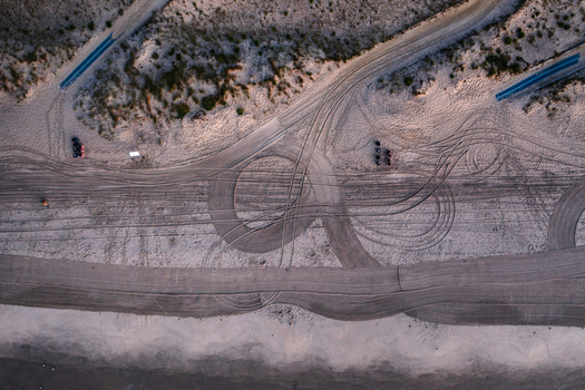 Aerial view of intricate tire tracks crisscrossing the sandy expanse of Sea Isle City Beach in Sea Isle City New Jersey United States.