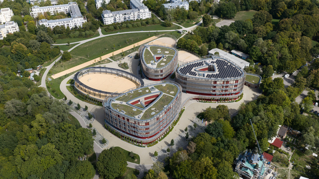 Durmersheim Germany 12 September 2026 Aerial view of Wilhelm Hausenstein Gymnasium featuring triangular buildings with green roofs and solar panels surrounded by parkland.