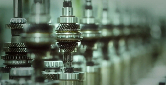 View of a series of precision engineered metal gears and shafts aligned on an industrial assembly line in a manufacturing facility in Jilin Jilin Province China. View of a series of precision engineered metal gears and shafts aligned on an industrial assembly line in a manufacturing facility in Jilin Jilin Province China.