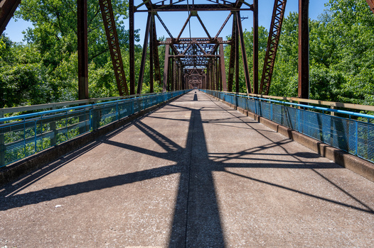 View of the historic Old Chain of Rocks Bridge with its steel truss structure and blue railings spanning across the Mississippi River in St. Louis Missouri United States. View of the historic Old Chain of Rocks Bridge with its steel truss structure and blue railings spanning across the Mississippi River in St. Louis Missouri United States.