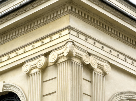 View of the ornate neoclassical architectural details including Ionic columns and decorative cornices on a historic building in Sariyer Istanbul Turkiye.