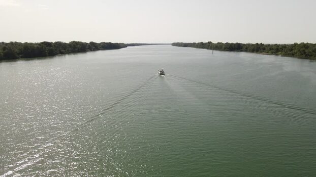 Aerial view of a boat cruising on the Loire river France. Aerial view of a boat cruising on the Loire river France.