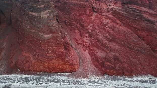 Aerial view of the volcanic Red beach cliffs in Fira Greece.