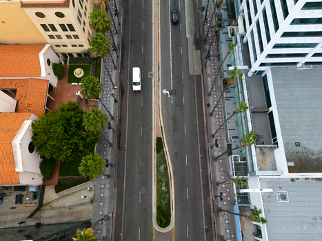 Aerial view of the Hollywood Walk of Fame with its iconic sidewalk stars palm trees and urban architecture along the street in Los Angeles California United States.