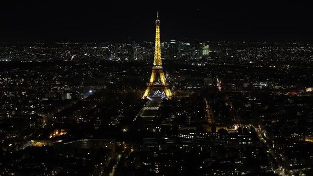 Aerial view of the illuminated Eiffel Tower at night France. Aerial view of the illuminated Eiffel Tower at night France.