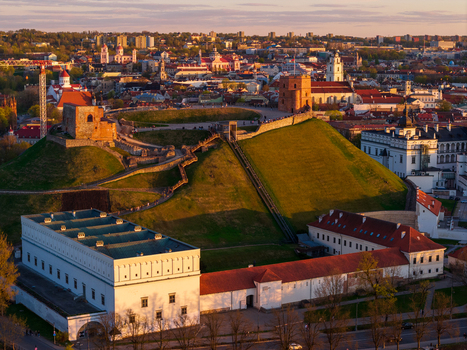 Aerial view of Gediminas Tower on the hill and the Palace of the Grand Dukes with the historic old town skyline at sunset Vilnius County Lithuania. Aerial view of Gediminas Tower on the hill and the Palace of the Grand Dukes with the historic old town skyline at sunset Vilnius County Lithuania.