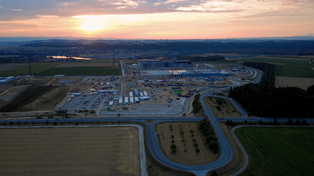 Aerial view of a data center construction site at sunrise with surrounding fields and roads in Kronstorf Upper Austria Austria.