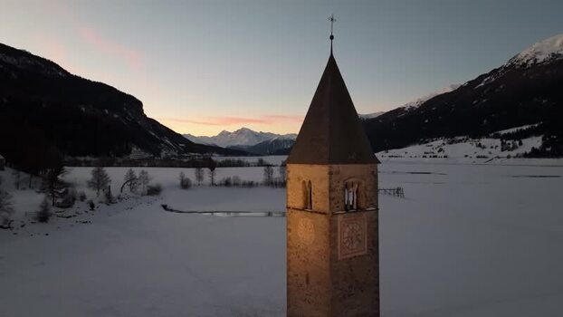 Aerial view of the historic bell tower in Graun im Vinschgau Italy. Aerial view of the historic bell tower in Graun im Vinschgau Italy.