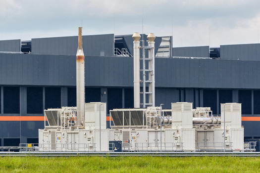 Middenmeer Netherlands 17 May 2026 View of Microsoft datacenters western europe on Agriport along the A7 with industrial cooling systems and exhaust stacks under a cloudy sky.