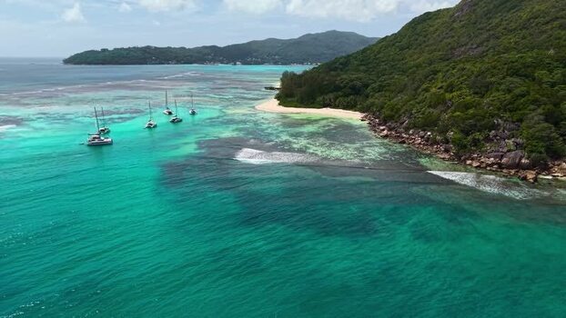 Aerial view of catamarans in turquoise waters Seychelles.