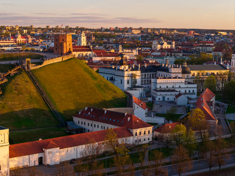 Aerial view of Gediminas Tower and the Palace of the Grand Dukes in Vilnius under warm sunset light in Vilnius County Lithuania. Aerial view of Gediminas Tower and the Palace of the Grand Dukes in Vilnius under warm sunset light in Vilnius County Lithuania.