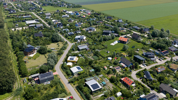 Aerial view of Ecodorp Bolderburen a sustainable community with modern houses solar panels and lush green gardens in Almere Flevoland Netherlands. Aerial view of Ecodorp Bolderburen a sustainable community with modern houses solar panels and lush green gardens in Almere Flevoland Netherlands.