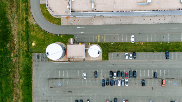 Aerial view of the parking lot with cars tanks and a building Sremska Mitrovica Vojvodina Serbia. Aerial view of the parking lot with cars tanks and a building Sremska Mitrovica Vojvodina Serbia.
