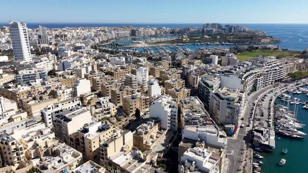 Aerial view of urban rooftops and marina in Ta Xbiex Malta. Aerial view of urban rooftops and marina in Ta Xbiex Malta.