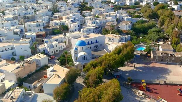 Aerial view of a Greek island village with a blue domed church Greece. Aerial view of a Greek island village with a blue domed church Greece.