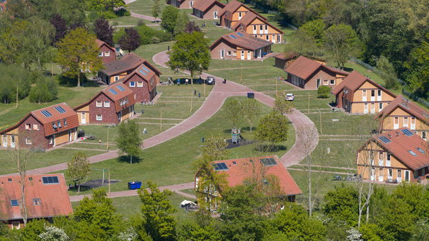 Drone view of AZC Luttelgeest in the Netherlands showing a reception centre for asylum seekers temporary housing community facilities and social infrastructure. Drone view of AZC Luttelgeest in the Netherlands showing a reception centre for asylum seekers temporary housing community facilities and social infrastructure.