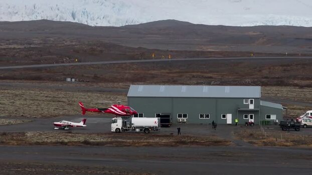 Aerial view of helicopter refueling at an airfield in Iceland. Aerial view of helicopter refueling at an airfield in Iceland.