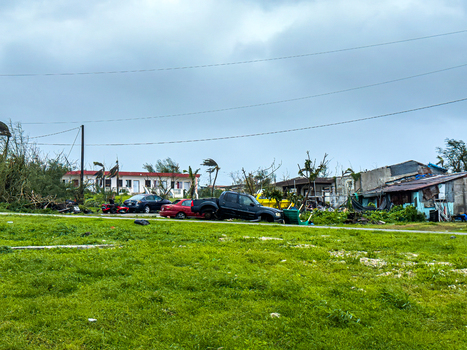 San Jose Tinian Northern Mariana Islands 06 July 2026 View of damage and debris scattered across a residential area following the passage of a typhoon with overcast skies and damaged trees. San Jose Tinian Northern Mariana Islands 06 July 2026 View of damage and debris scattered across a residential area following the passage of a typhoon with overcast skies and damaged trees.