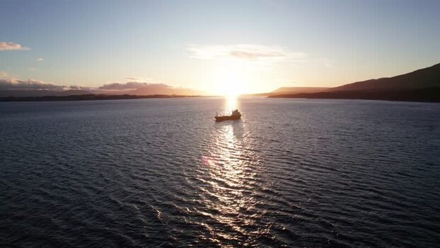 Aerial view of a ship at sunset in Puerto Williams Chile.