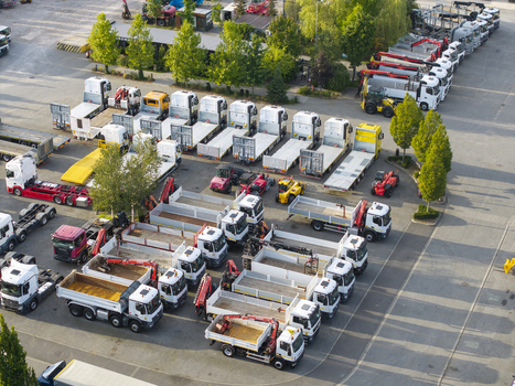 Krakow Poland 16 September 2026 Aerial view of the Ciezarowki.pl truck yard featuring numerous commercial trucks trailers and construction vehicles parked in rows.