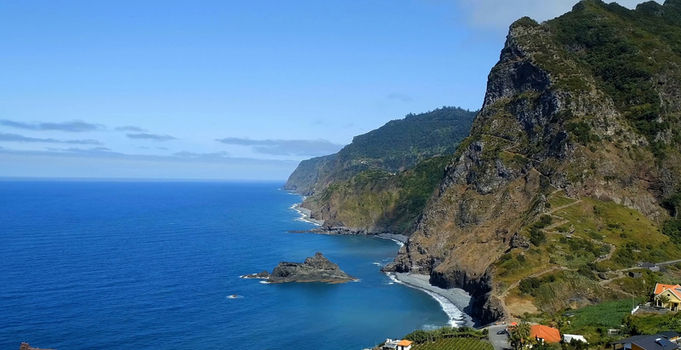 Aerial view of Ursa Beach featuring dramatic cliffs rocky coastline and the deep blue Atlantic Ocean in Colares Portugal. Aerial view of Ursa Beach featuring dramatic cliffs rocky coastline and the deep blue Atlantic Ocean in Colares Portugal.