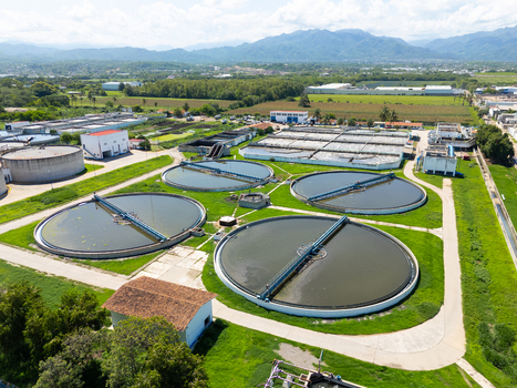 Aerial view of circular water treatment tanks contrasting against the verdant landscape Puerto Vallarta Mexico. Aerial view of circular water treatment tanks contrasting against the verdant landscape Puerto Vallarta Mexico.