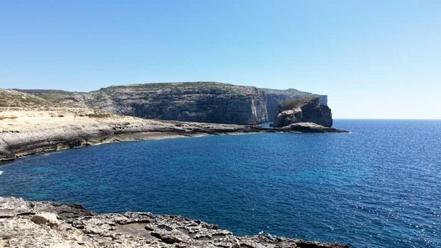 Aerial view of Fungus Rock and the rugged cliffs of Dwejra Bay Malta. Aerial view of Fungus Rock and the rugged cliffs of Dwejra Bay Malta.