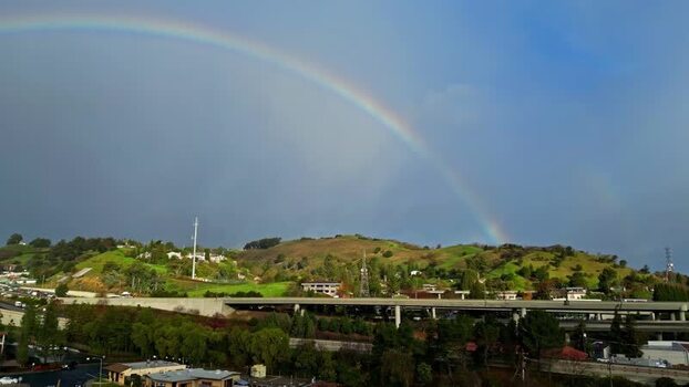 Aerial view of a rainbow over San Francisco hills United States.