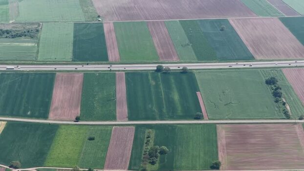 Aerial view of agricultural fields and highway in Selestat France.