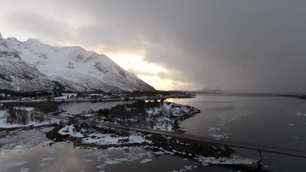 Aerial view of Lofoten bridge in snowy winter landscape Norway.