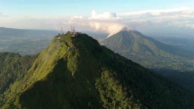 Aerial view of Mount Telomoyo and lush volcanic peaks Indonesia.