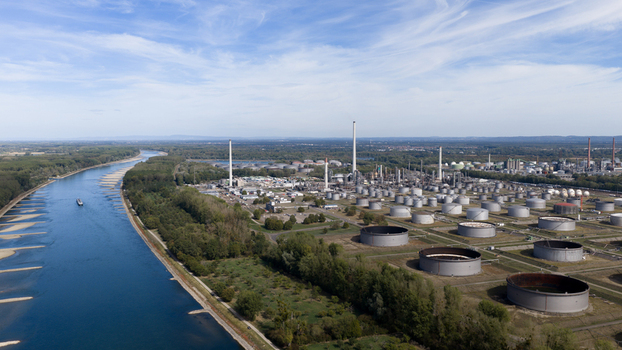 Aerial view of the Mineralolraffinerie Oberrhein industrial complex along the Rhine river with storage tanks and processing facilities in Karlsruhe Baden Wurttemberg Germany. Aerial view of the Mineralolraffinerie Oberrhein industrial complex along the Rhine river with storage tanks and processing facilities in Karlsruhe Baden Wurttemberg Germany.