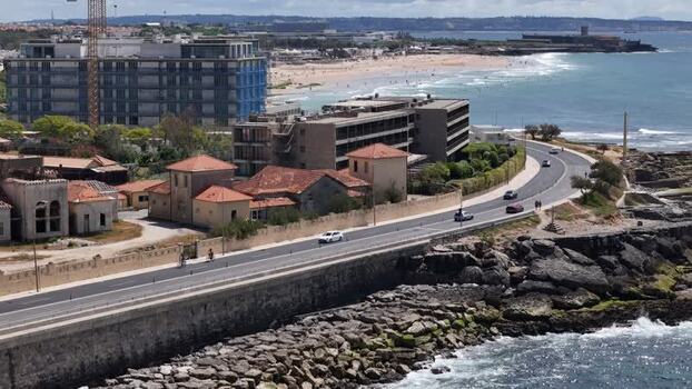 Aerial view of Carcavelos beach and the coastal road in Lisbon Portugal.