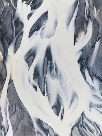 Aerial view of glacial rivers carving paths through the stark landscape a dance of light and shadow Lake Tekapo Canterbury Region New Zealand. Aerial view of glacial rivers carving paths through the stark landscape a dance of light and shadow Lake Tekapo Canterbury Region New Zealand.