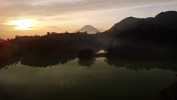 Aerial view of Dieng lake and mountain at sunrise Indonesia. Aerial view of Dieng lake and mountain at sunrise Indonesia.