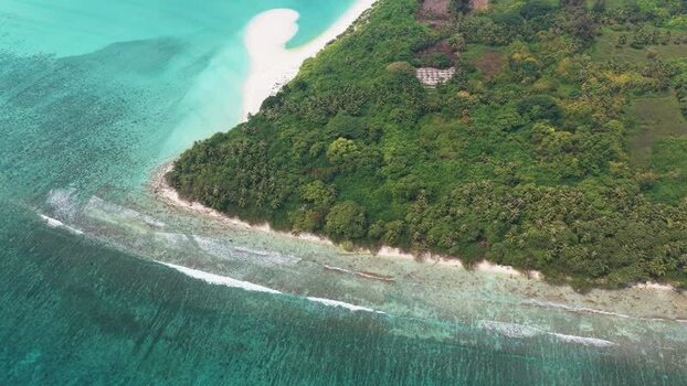 Aerial view of Vaikaramuraidhoo island in the Maldives. Aerial view of Vaikaramuraidhoo island in the Maldives.
