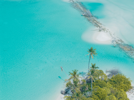 Aerial view of the tropical island s white sands meet the turquoise ocean a serene escape under the equatorial sun Thuraakunu Thiladhunmathee Uthuruburi Maldives. Aerial view of the tropical island s white sands meet the turquoise ocean a serene escape under the equatorial sun Thuraakunu Thiladhunmathee Uthuruburi Maldives.